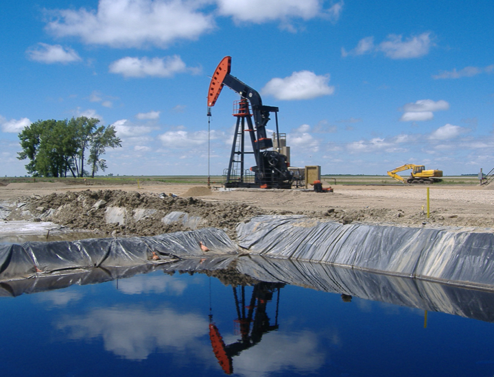Pumpjack pictured over a reserve pit